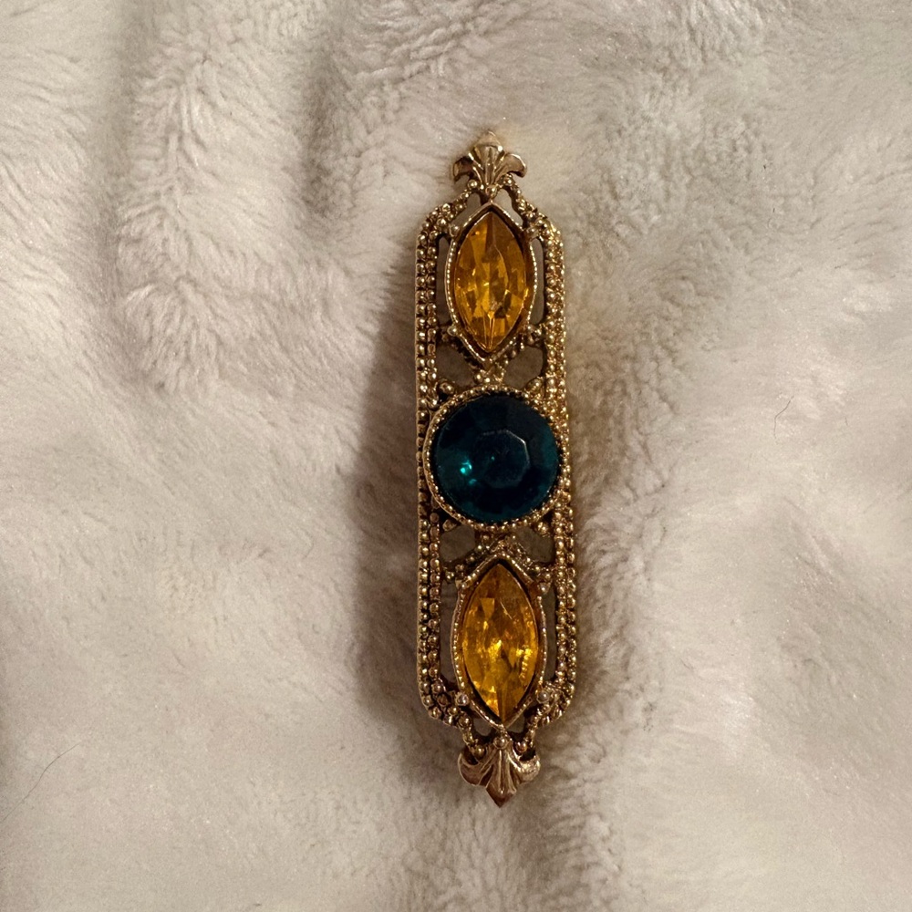 Elegant Gold and Blue Brooch